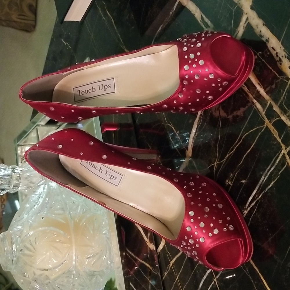 Women's red satin high heels.